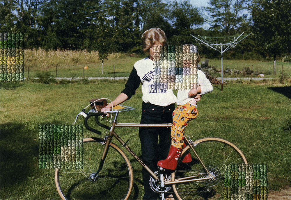 A woman with a child and a bicycle with stitches