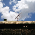 a tv antenna on roof of a train