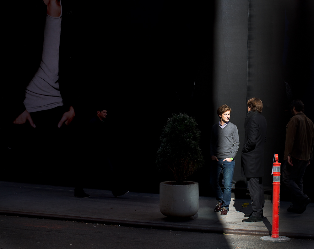 People standing on a corner.