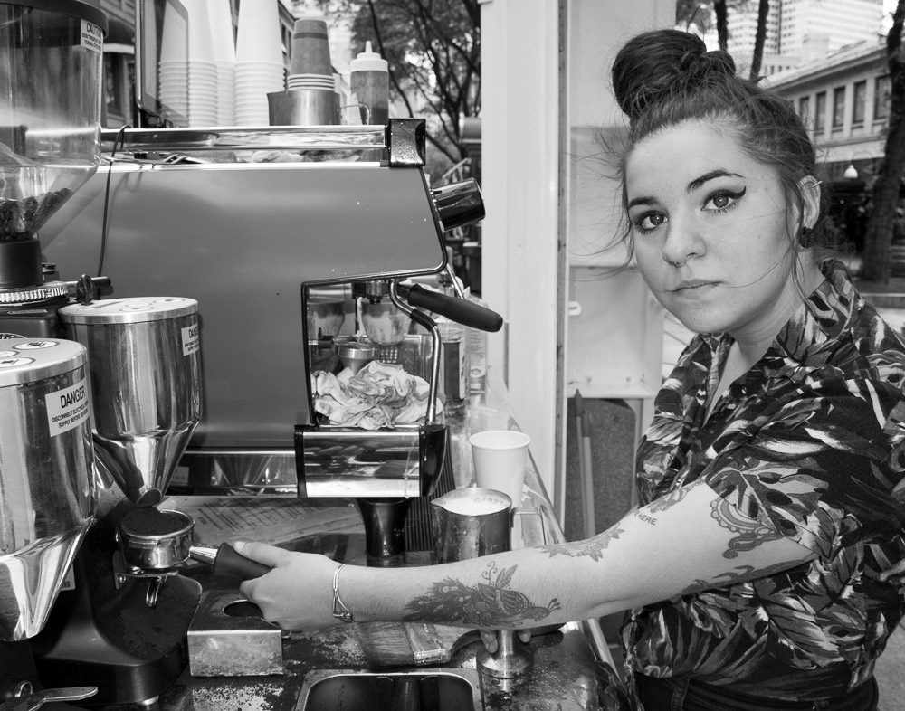 Woman making coffee.