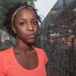 A woman in orange shirt