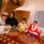 5 young Afghanistan children sit on a floor.