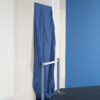 Blue curtain on white wall