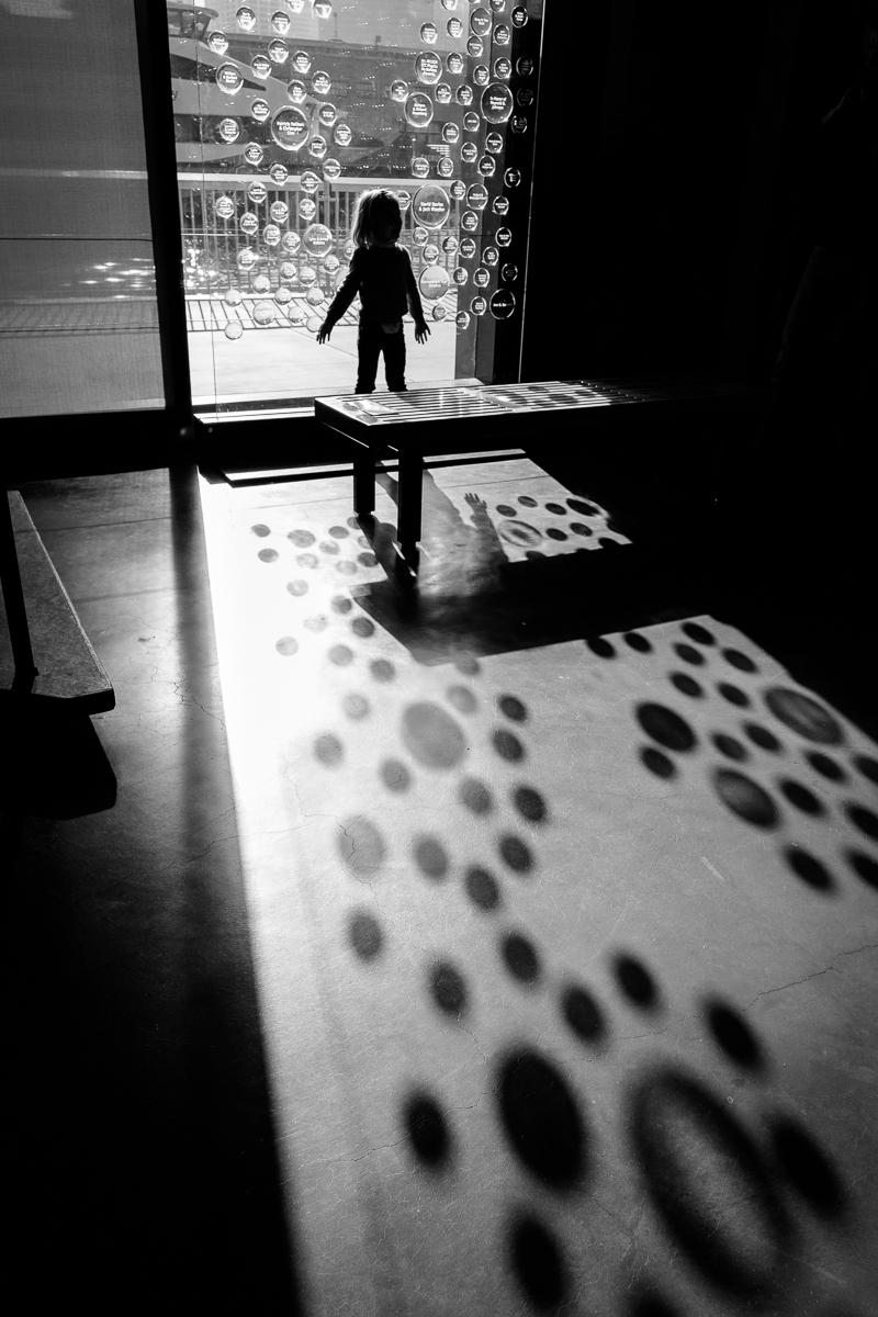 Person on path with shadow dots