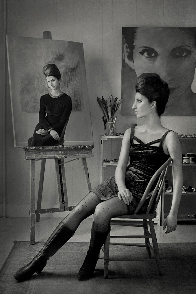 Woman in front of a painted portrait of her