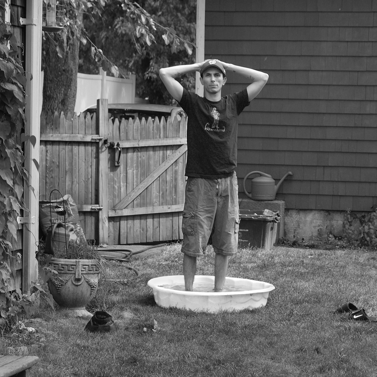 Man standing in a wading pool