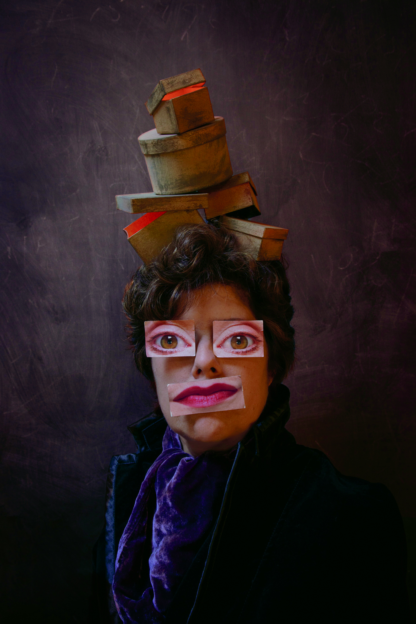 Woman with boxes on her head and cutout eyes and mouth