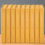 Nine copies of a yellow book