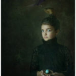Girl holding a robin's nest