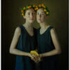 Two girls with flowered wreathes on their heads