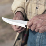 Man holding a buck knife