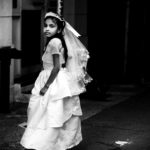 Young girl in wedding gown and veil