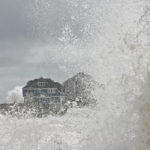 Huge waves coming in towards houses