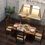 A miniature dining room with a set table