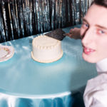 A man cutting a cake