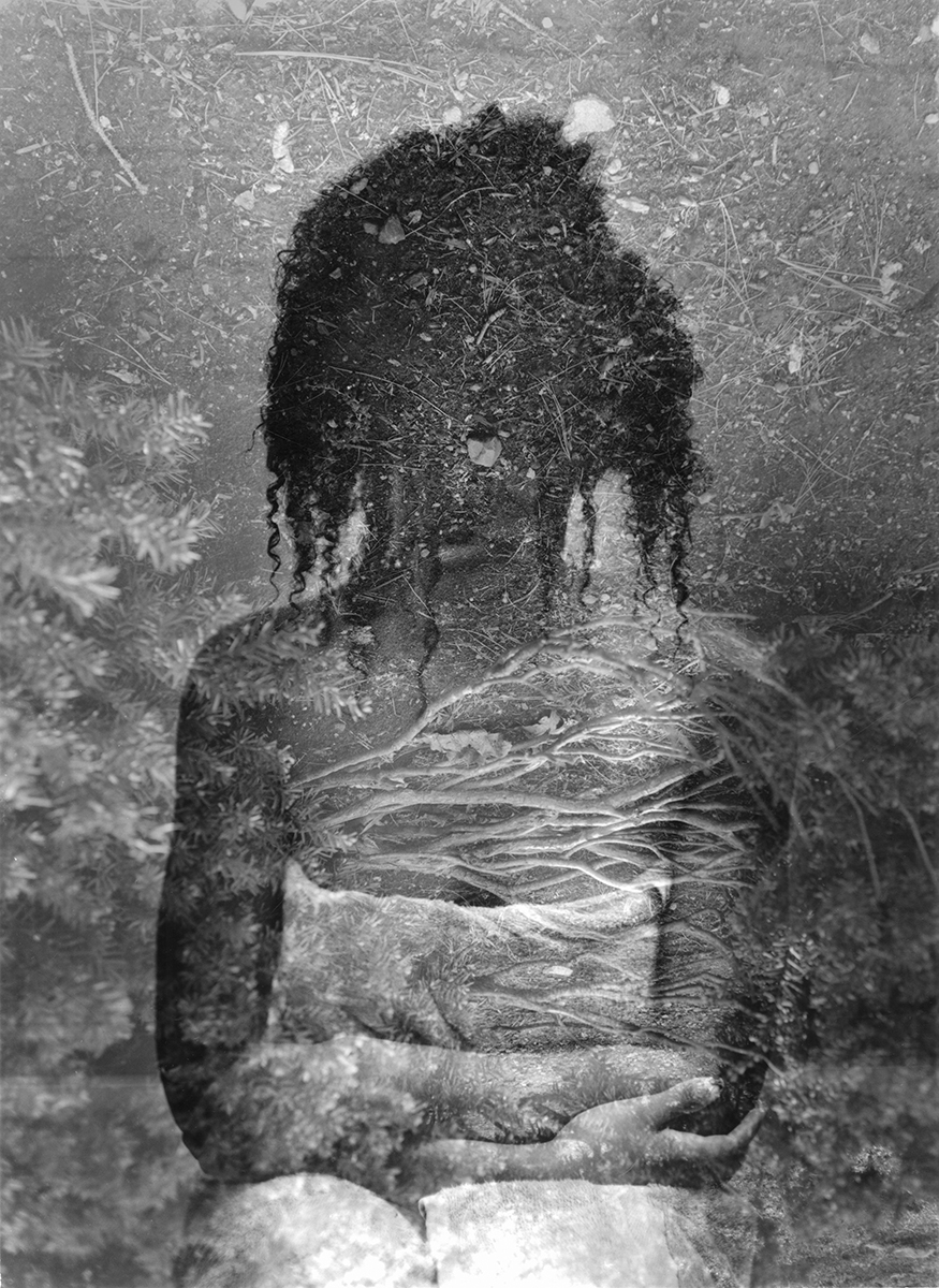 double exposure of a figure of a woman and dirt.