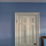 A door with blue painted wall