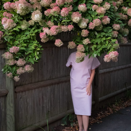 woman under flowered tree