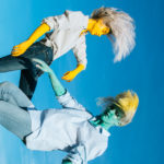 two men with long hair dancing