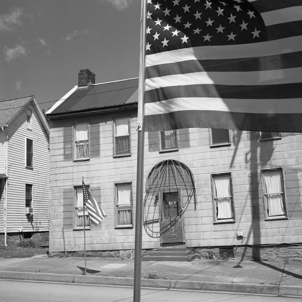 American Flag and Old Building. Bill Franson