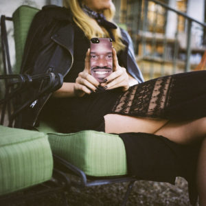 someone on a couch holding a picture