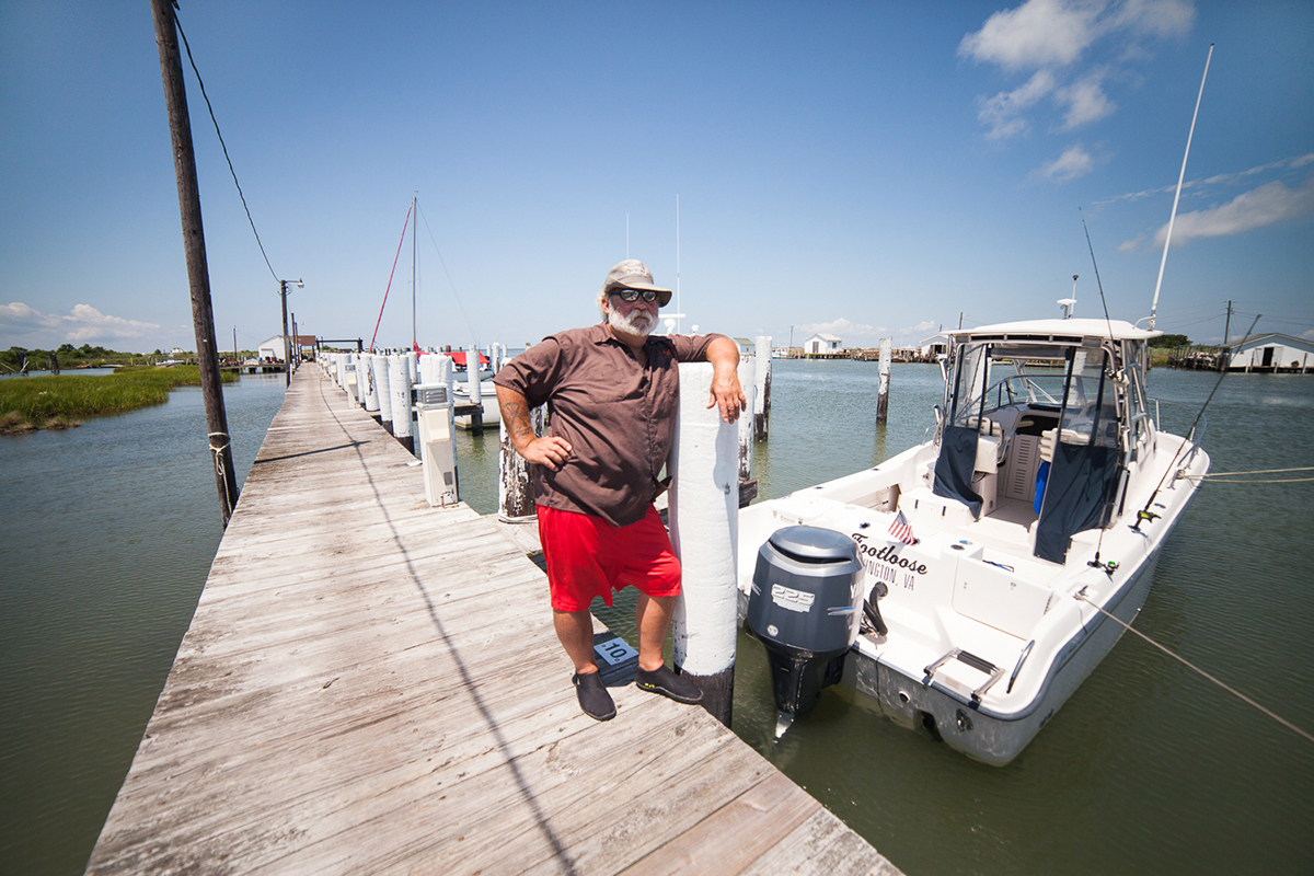 man on dock by boat