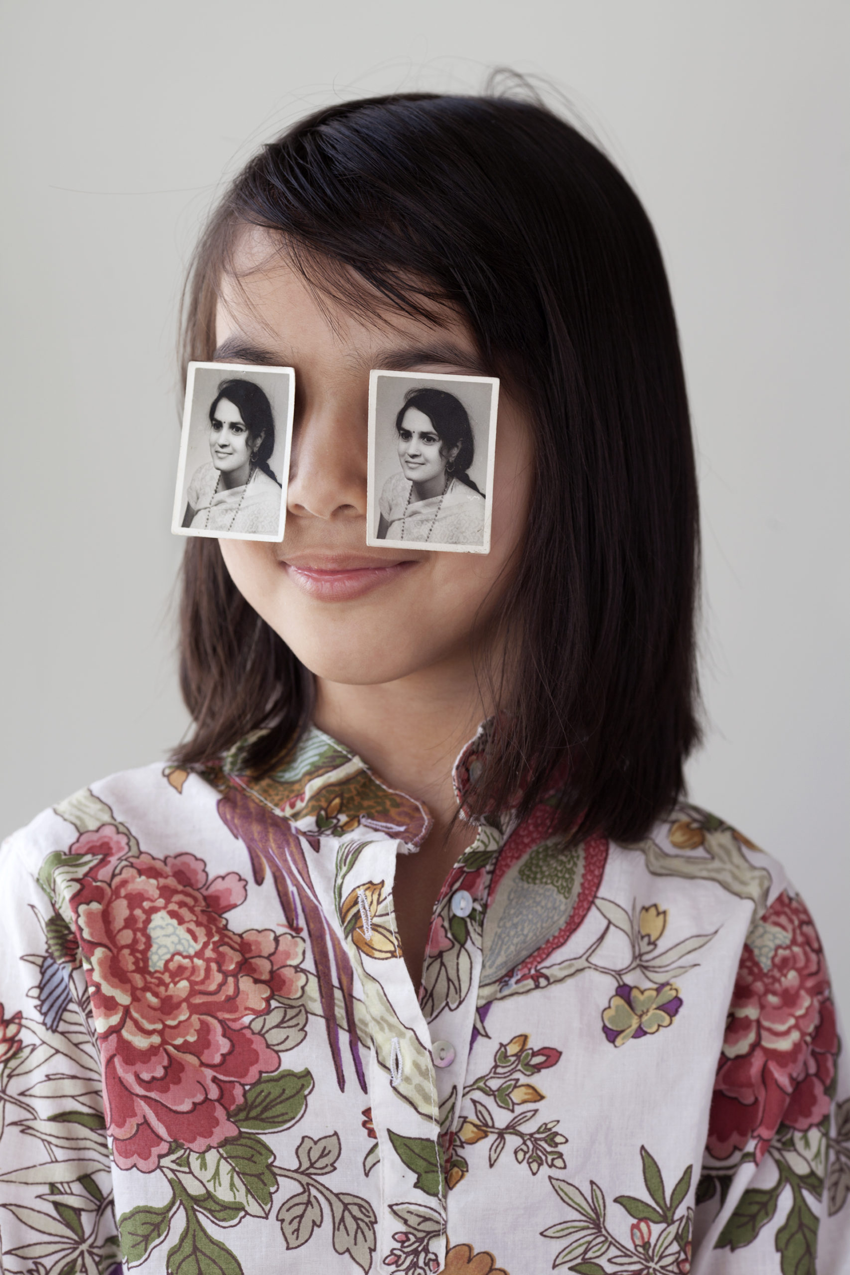 girl with pictures over her eyes