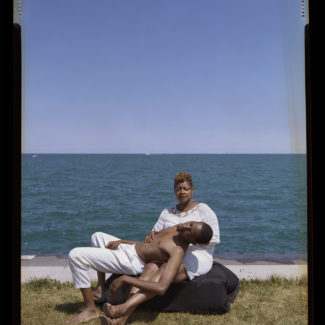man in mother's lap