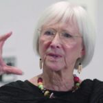 woman gestures with her hand