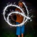 boy swirling sparks