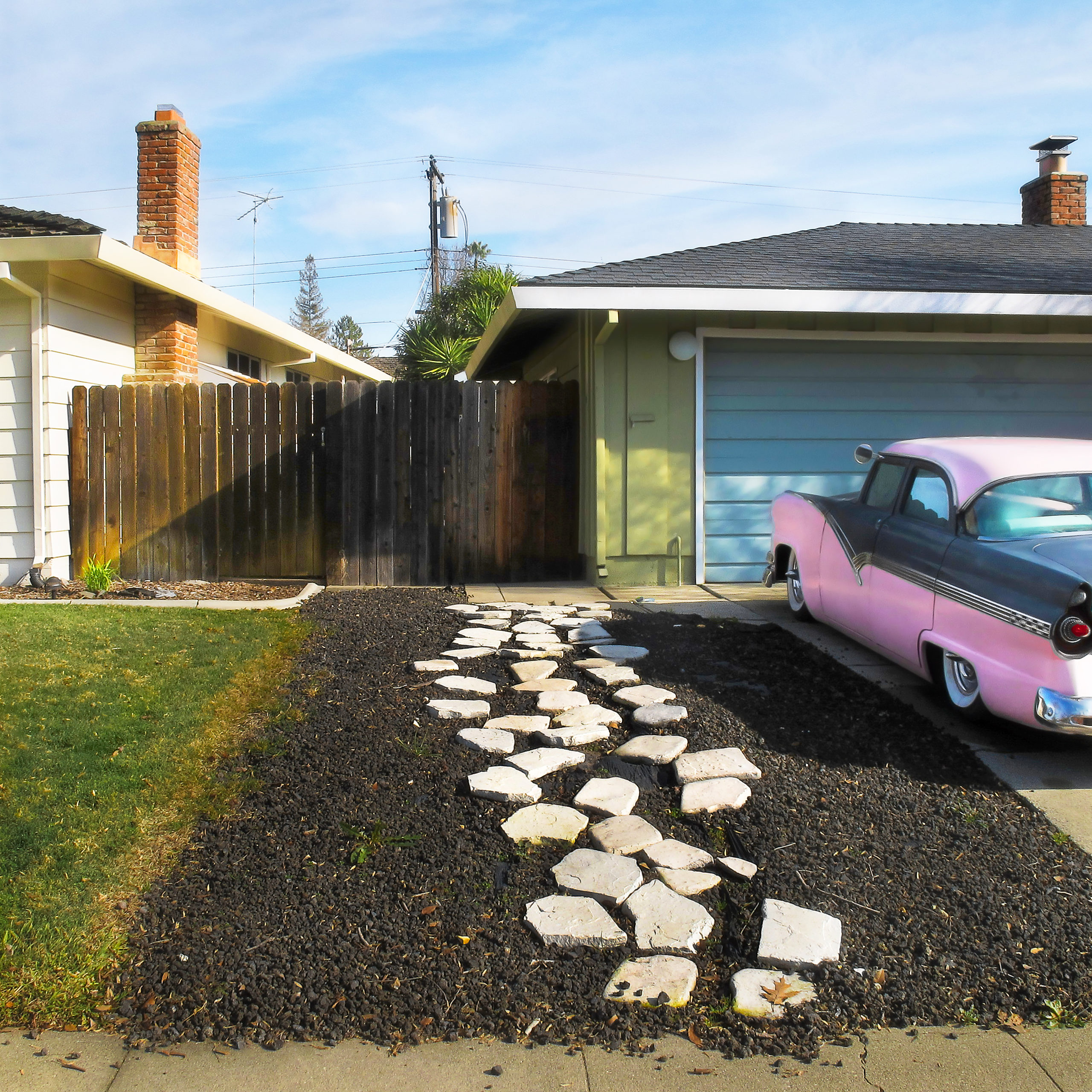 pink car in driveway