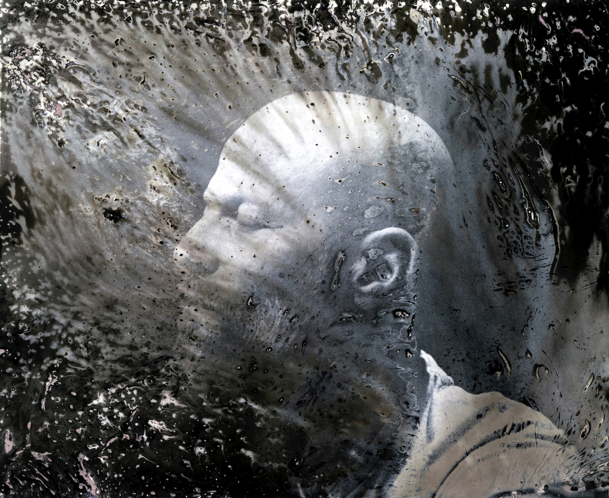 bald man dissolving from the head