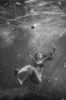 woman sinking in water