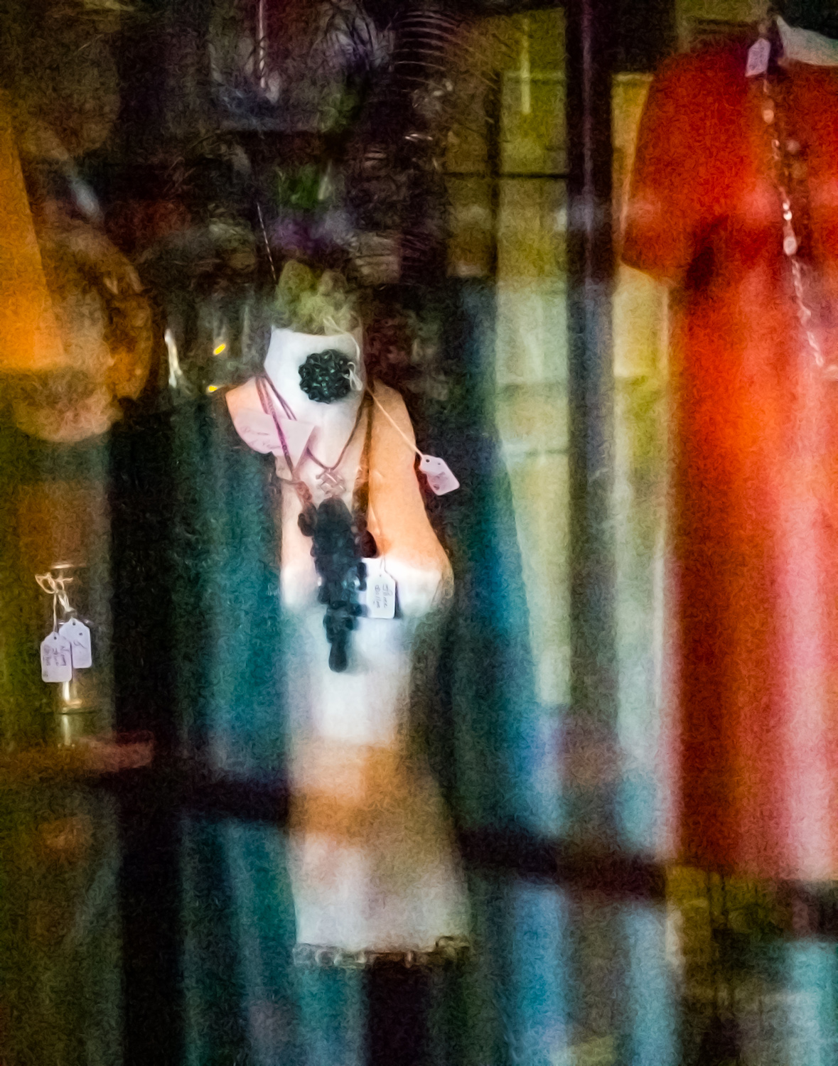 Reflections on glass over mannequin