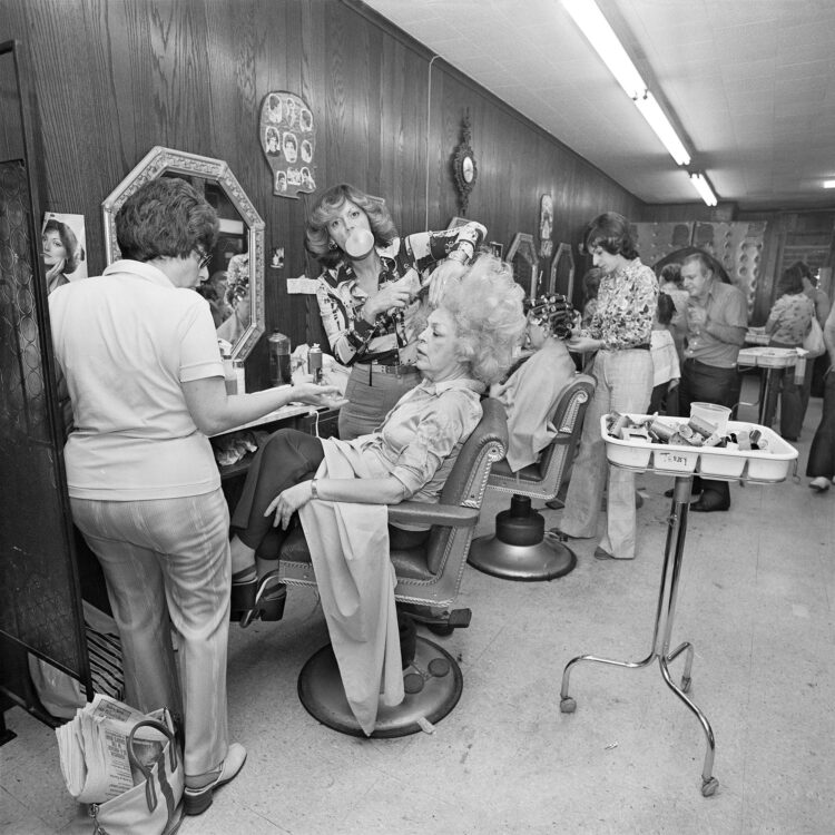 © Meryl Meisler, Mom Getting her hair Teased at Besame Beauty Salon North Massapequa, NY, June 1976, Gelatin Silver Print.